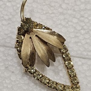 Gold Tone Leaf With Subtle Green Rhinestone Brooch